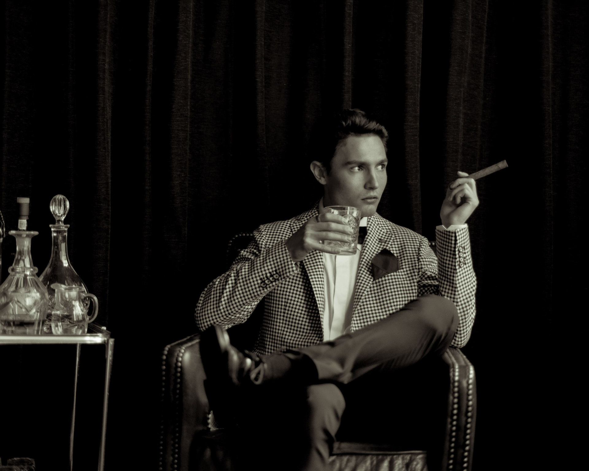 A client seated in a private members' club lounge